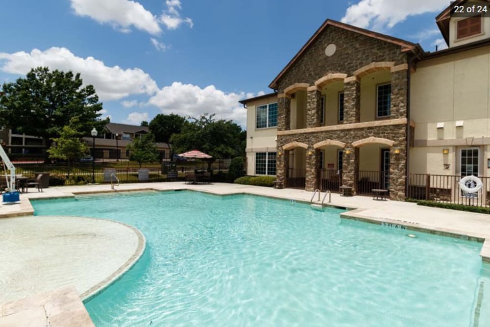 Pool side view of apartment at North Court Villas in Frisco, Texas