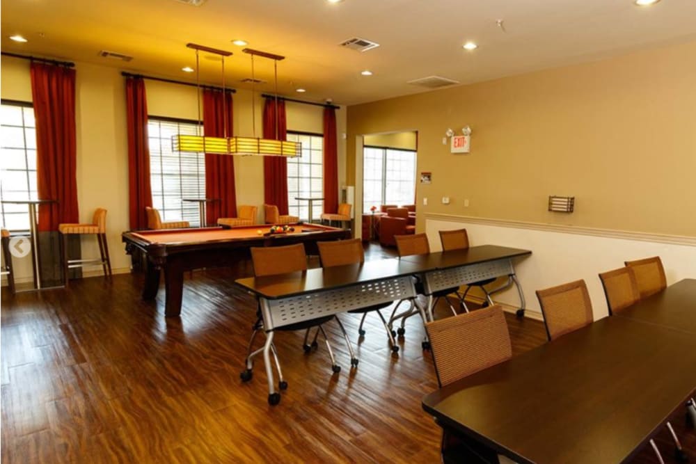 Community kitchen area with pool table at North Court Villas in Frisco, Texas