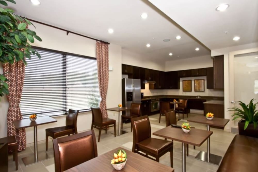 Community kitchen area with seating at North Court Villas in Frisco, Texas